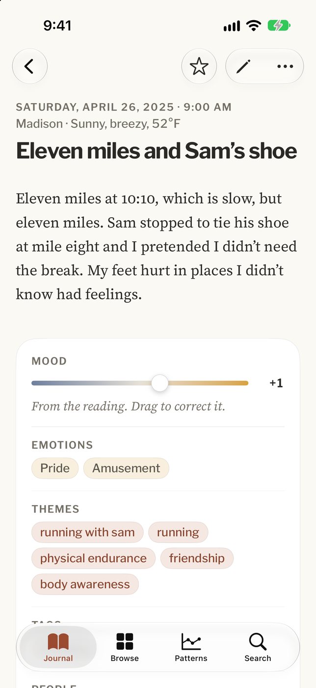 An entry on an iPhone with its mood, emotions and themes below the text.